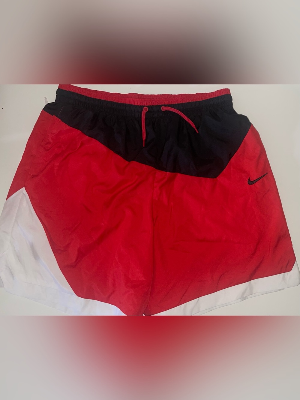 Nike Red Shorts with White Mesh Lining and Black Swoosh